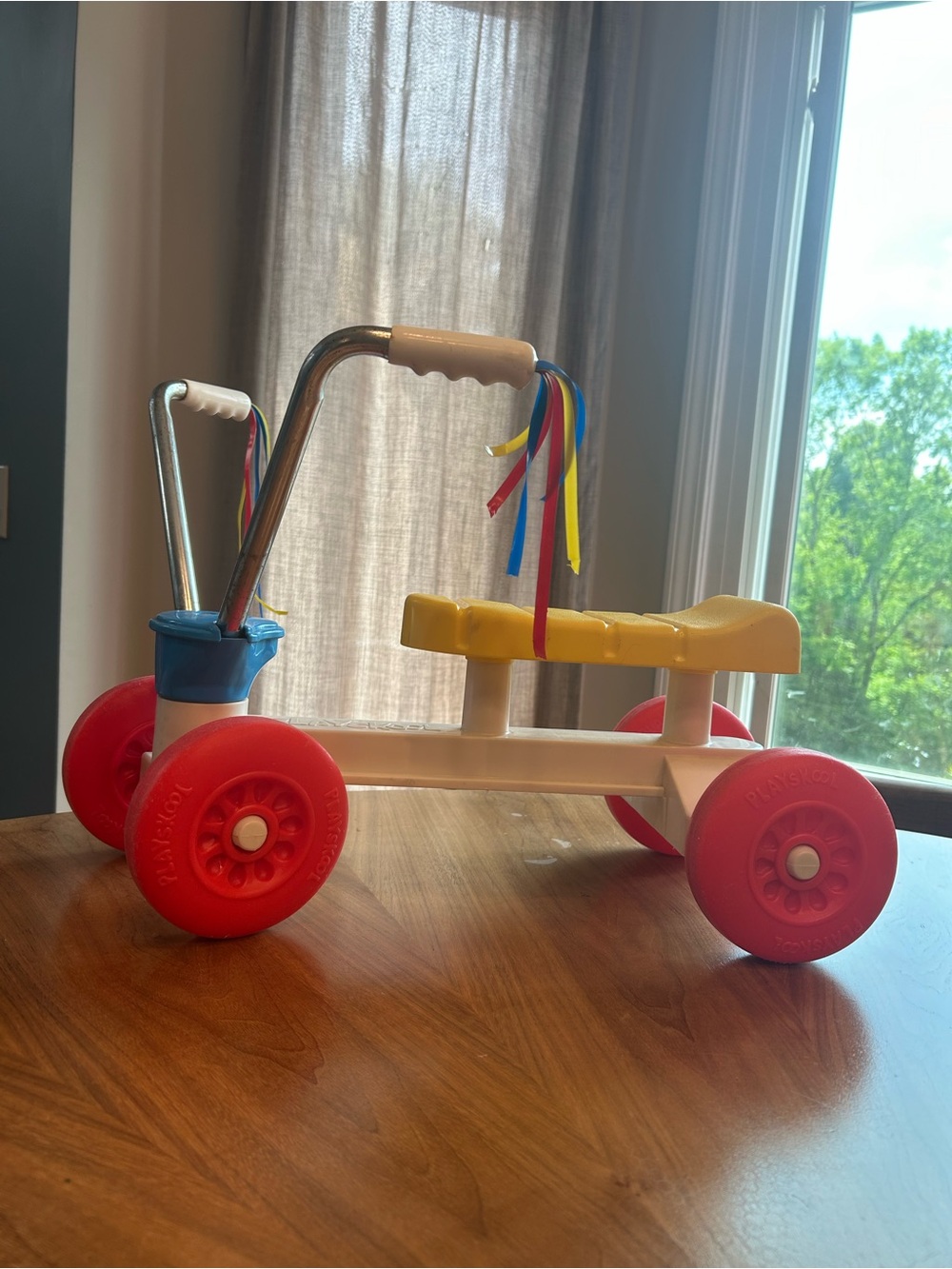 Vintage 1980s Toddler Ride-On Walker with Yellow Seat and Red Wheels